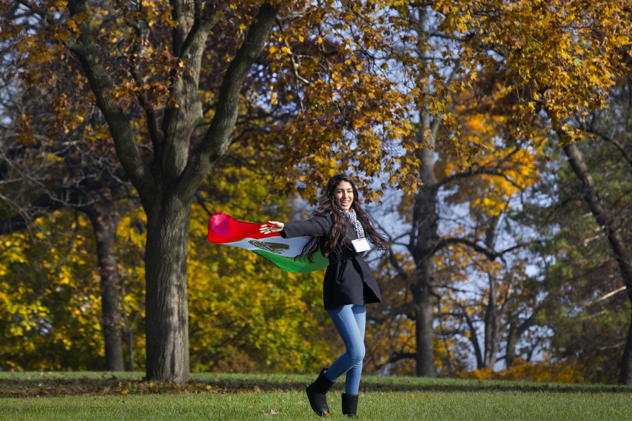A visiting student from Mexico waves the Mexican flag