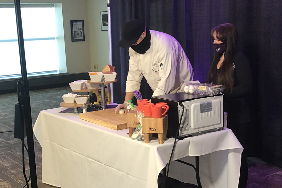 Chef standing at a table making food