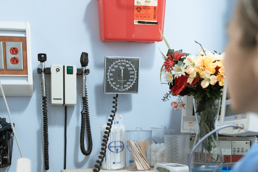 Medical equipment hangs on a wall.