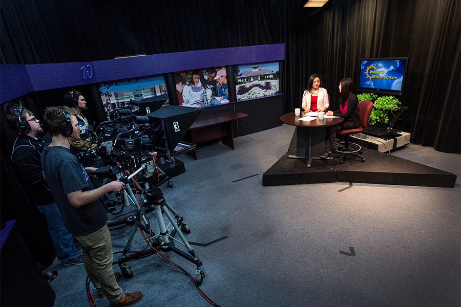 Students conduct a broadcast in the UWW-TV station on the UW-Whitewater campus.