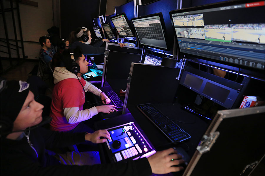 Students work with several monitors to broadcast a basketball game at UW-Whitewater.