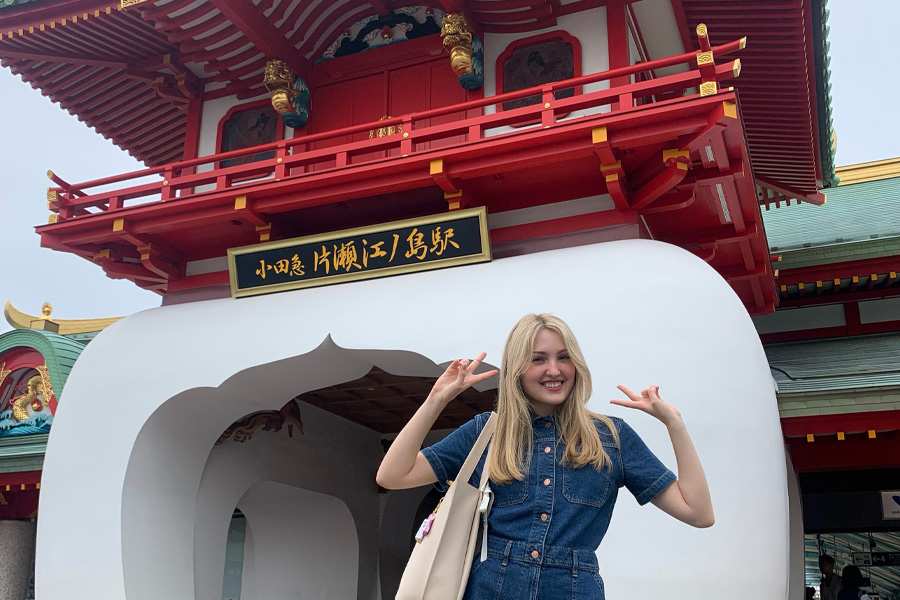 A UW-Whitewater student stands in front of a pagoda in Japan.