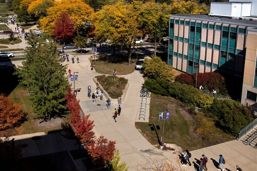 An aerial view of sidewalks and Upham Hall with colorful fall trees.