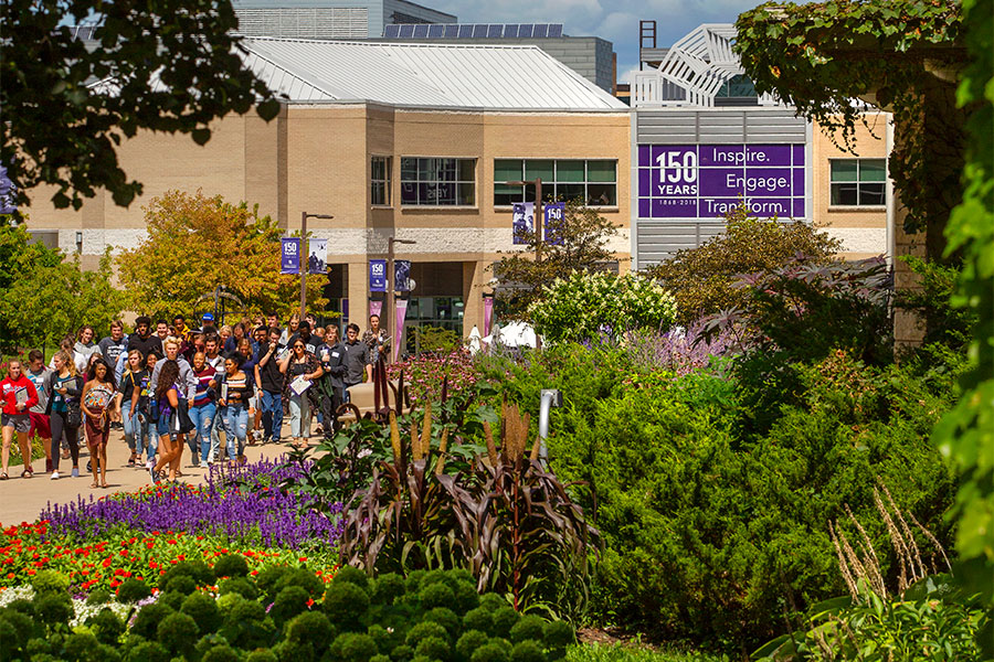 A tour is lead outside of the University Center on the UW-Whitewater campus.