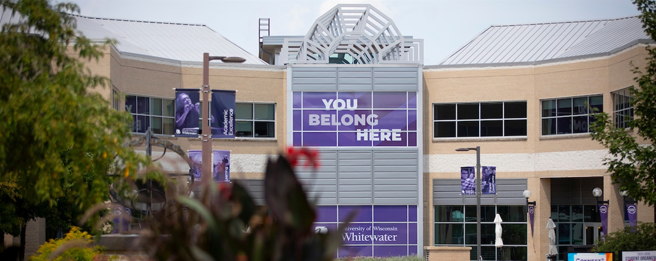 University center front entrance with banner that say You Belong Here.