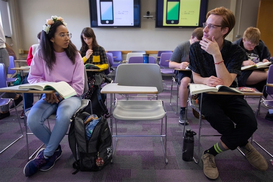 Two ladies read books in the University Center