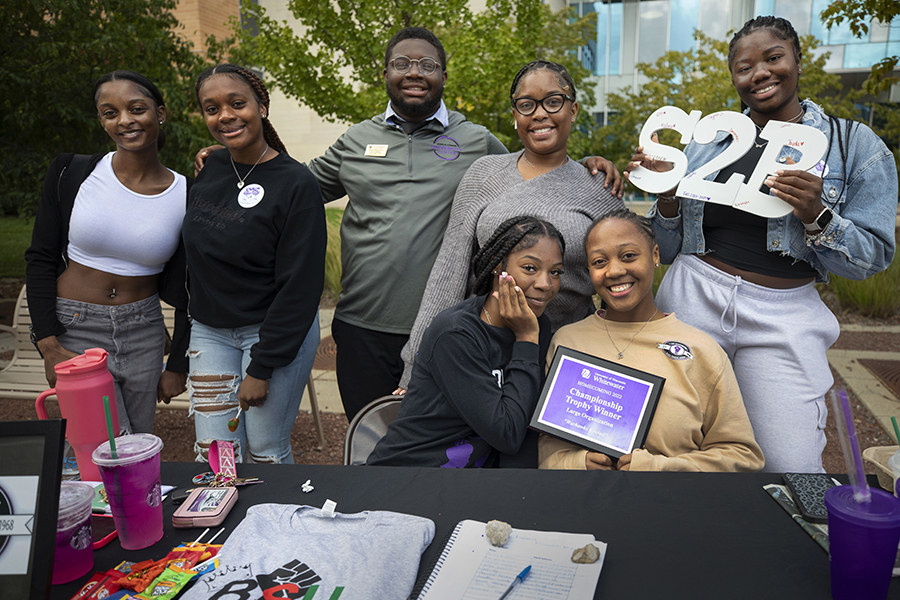 Several members of the Black Student Union group together for a photo.