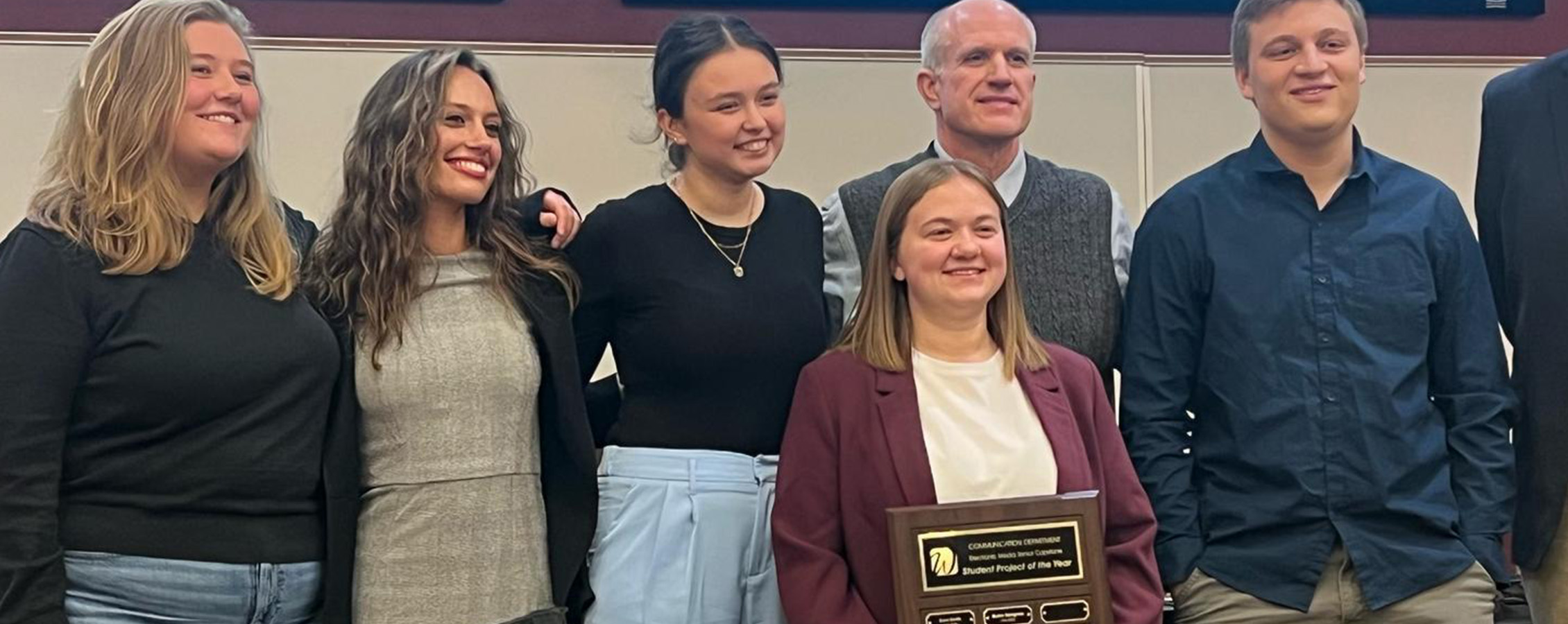 Emma Gailloreto with a group showing her award