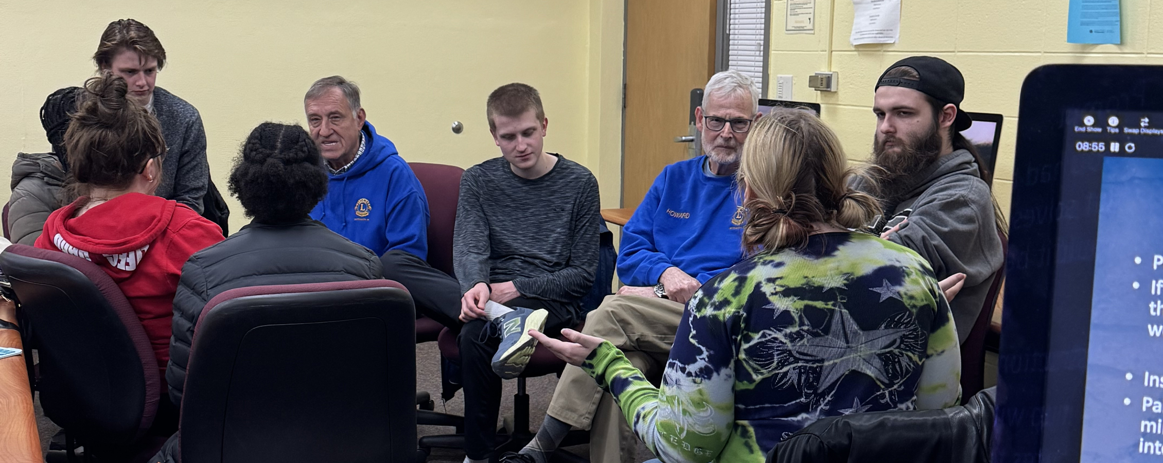 Students sit in a classroom.