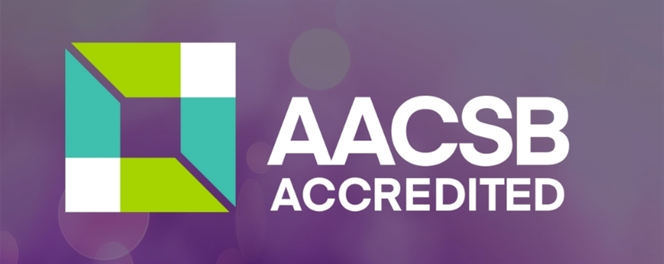 AACBS Accredited log with purple background