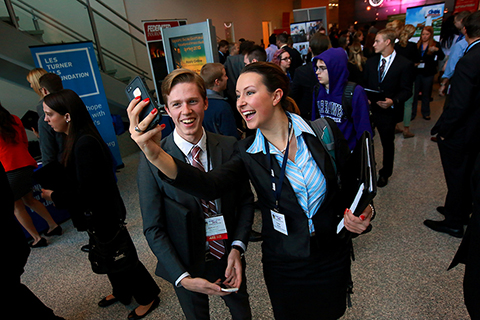 UW-Whitewater juniors Nate Hayworth and Karlee Nimmer pose for a selfie in the lobby of Hyland Hall at the AMA conference. 