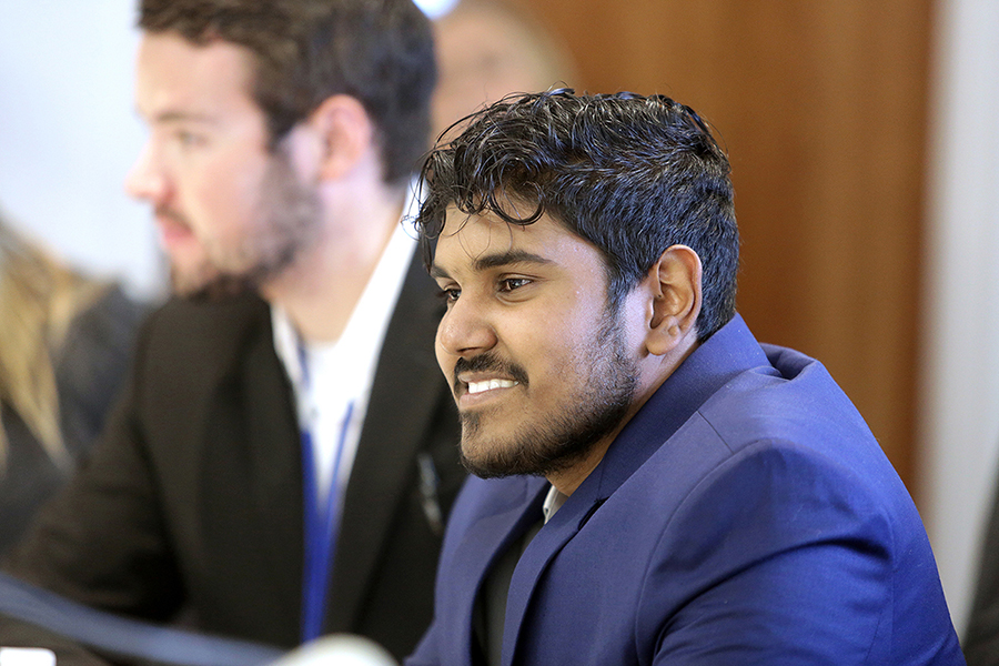 Accounting major Joseph Barrett smiles as members of the UW-Whitewater Institute of Management Accountants (IMA) organization listen to a panel discussion.