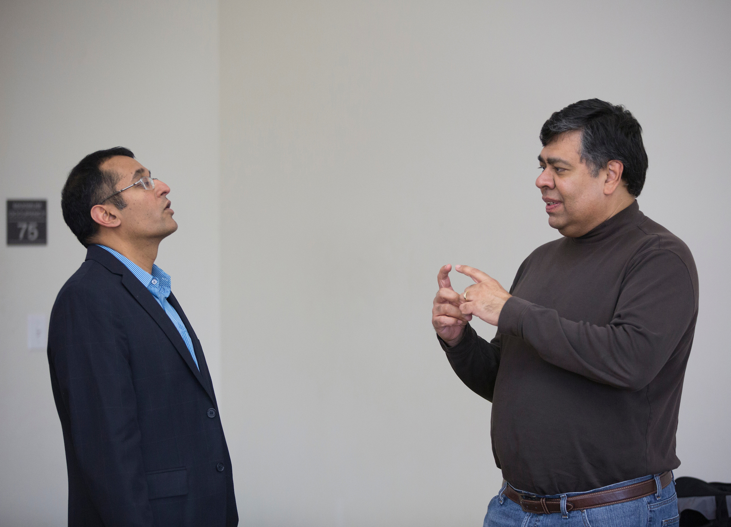 Henry Balani, right, in a discussion with Professor of Management Praveen Parboteeah, who established the DBA program at UW-Whitewater.