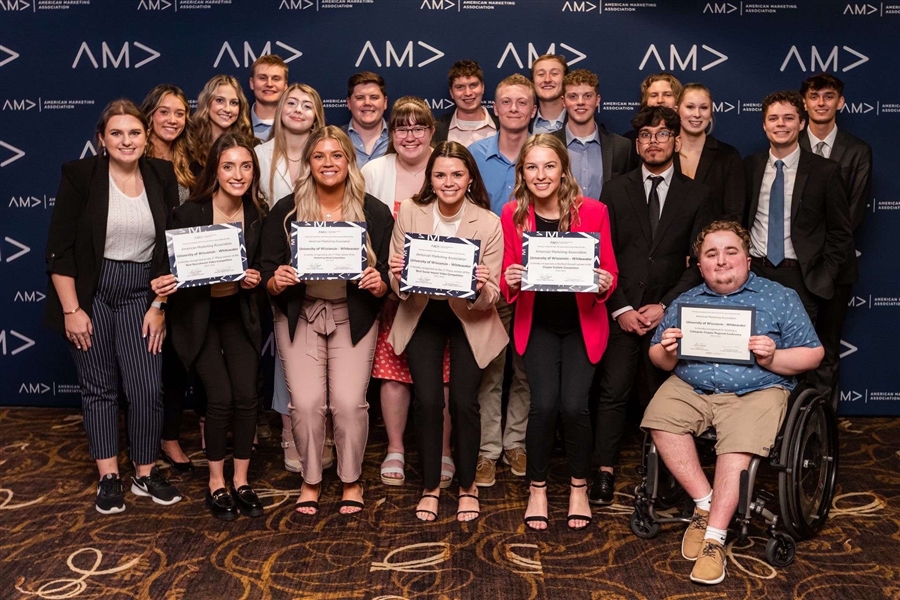 AMA students pose with awards.