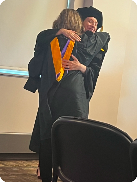 Hugs professor for thankful support