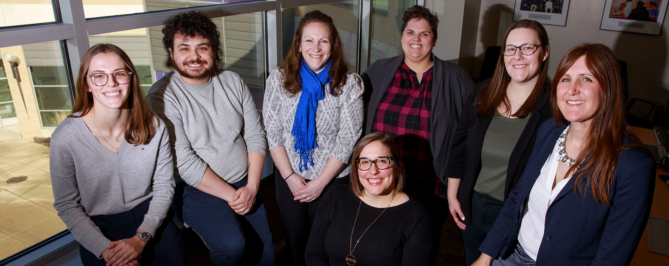 FYE team members sit in office