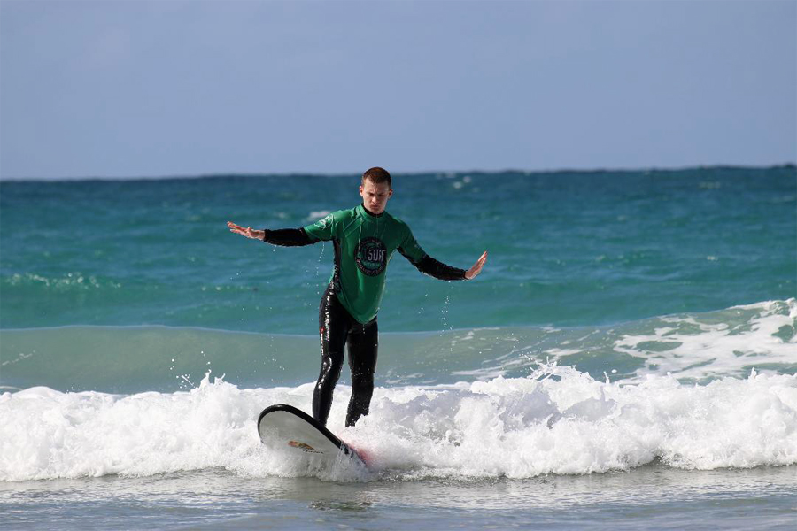 A person surfing in the ocean.