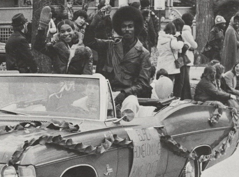 King and Queen of Black Homecoming riding in a convertible in the Homecoming Parade