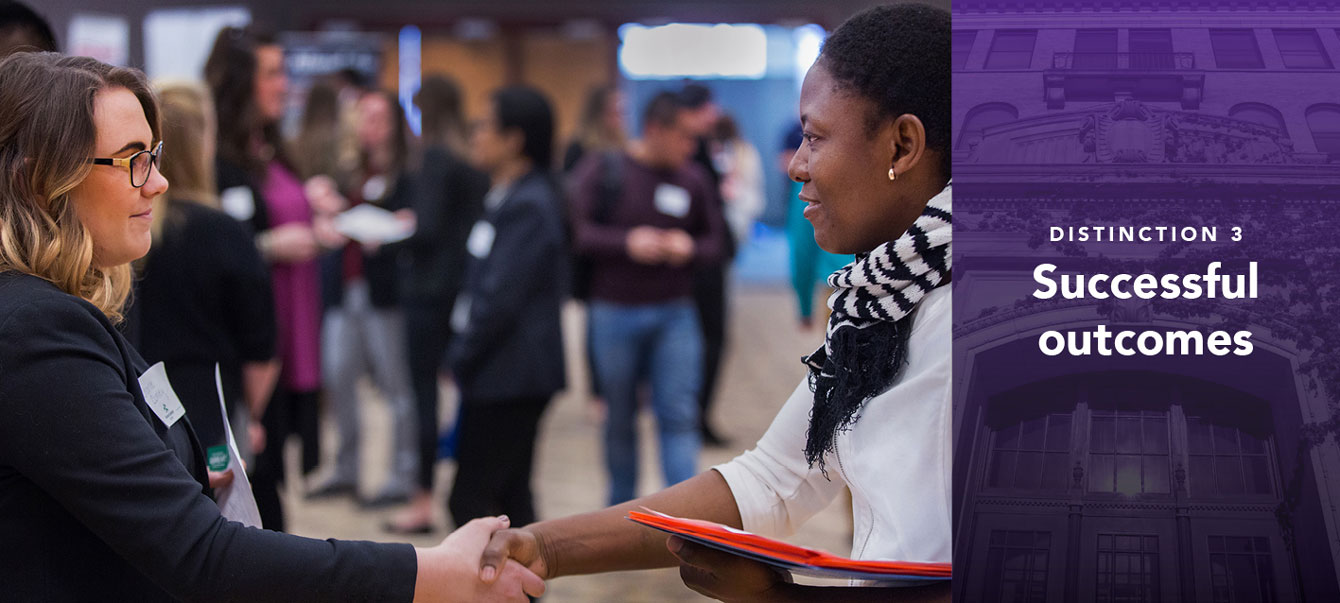 Charlie Conley, left, of Associated Bank, Milwaukee, and UW-Whitewater economics student Mifayakou Baba shake hands after meeting at the Hawk Career Fair in the Hamilton Room of the University Center. During this event, employers discuss full-time employment, internships, continuing education and other opportunities with students.
