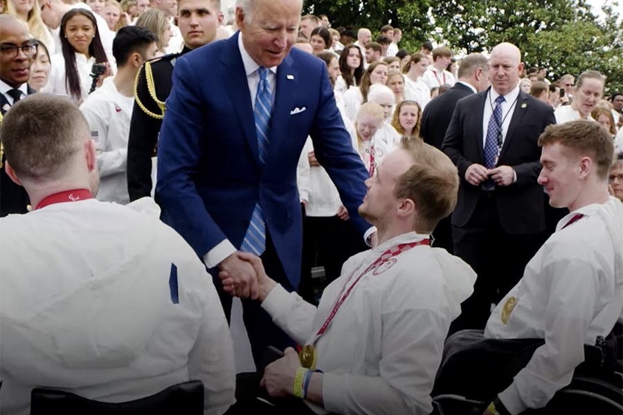 John Boie shakes hands with Joe Biden in front of the White House.