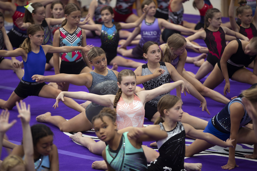 Young campers participate in gymnastics.