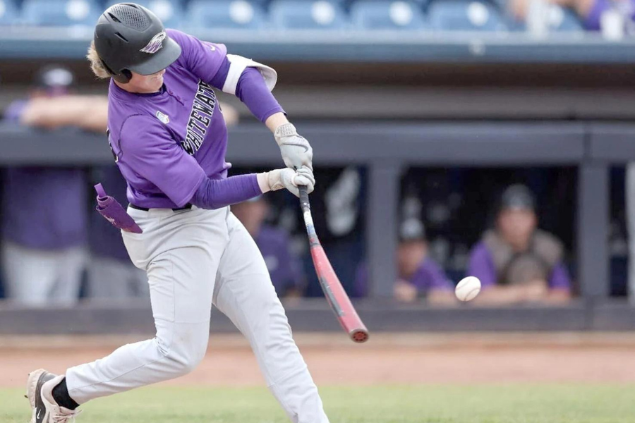 baseball player hitting baseball