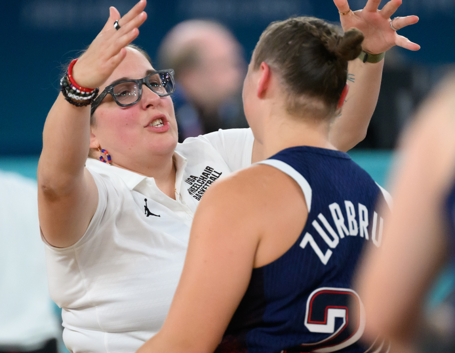 Coach Christina Schwab reaches out to hug Lindsey Zurbrugg. 