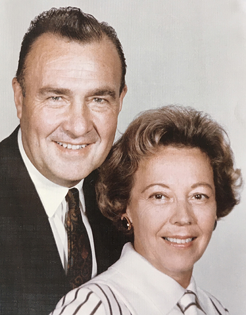 Harold Perry poses for a photo with his wife.