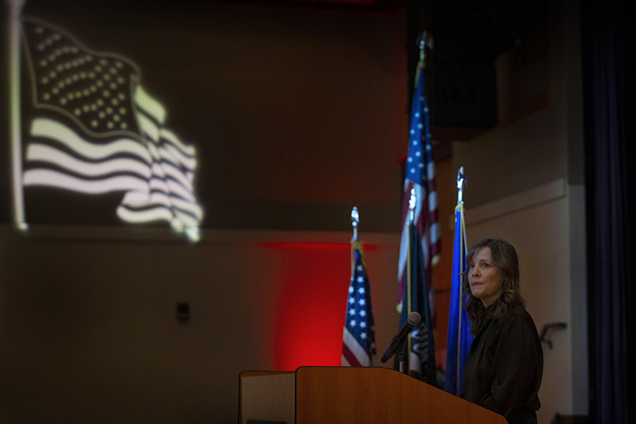 Amy Moore stands at a podium.