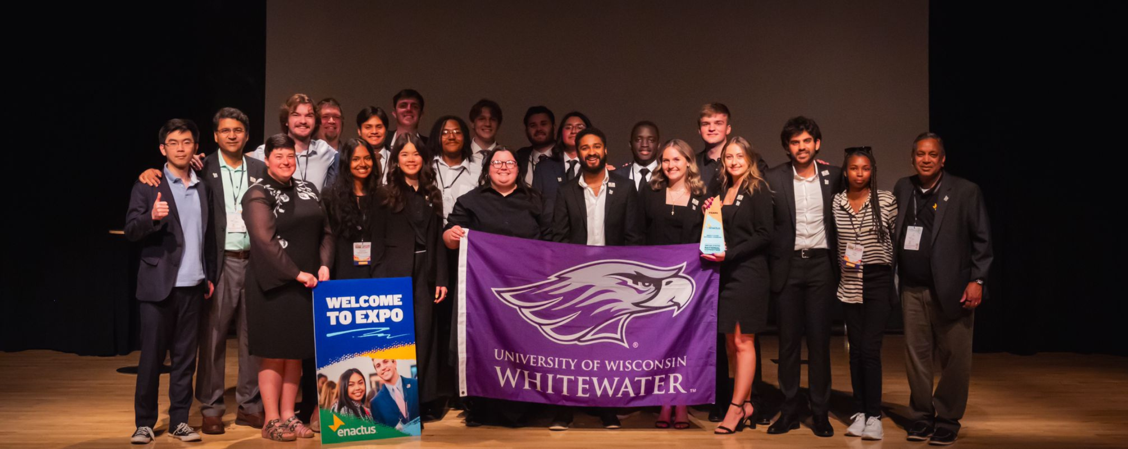 The Enactus group posing for photo with Willie Flag.