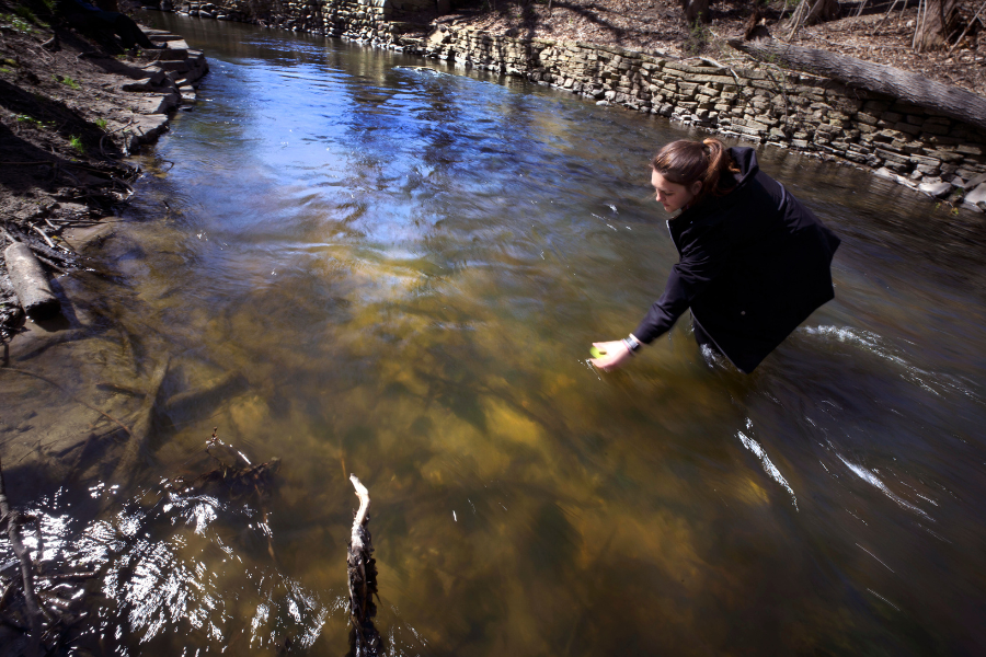 Student is doing work on river.