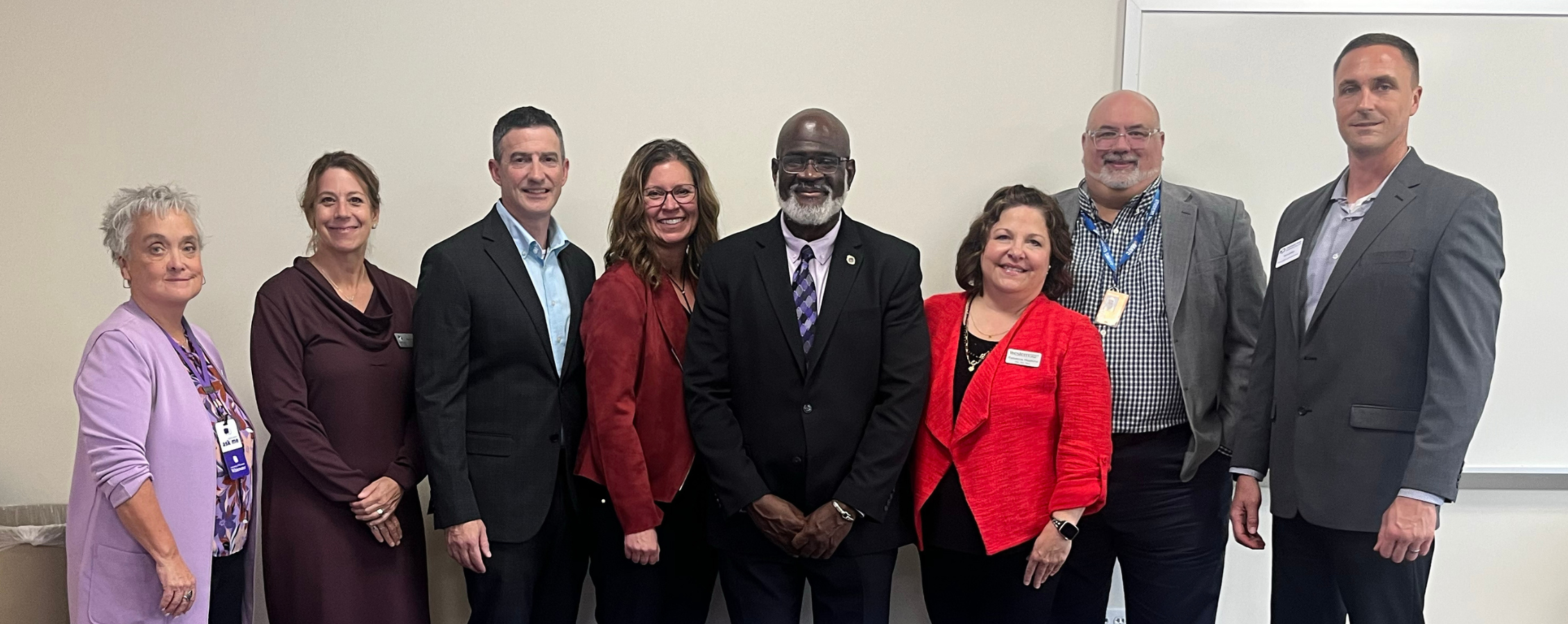 Chancellor King poses with several other staff.