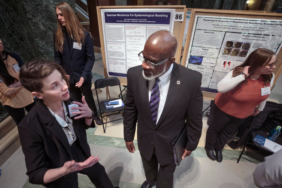 Kaylynn Bacon, left, from Albany, describes her research to Chancellor Corey A. King. UW-Whitewater student researchers visited the Wisconsin State Capitol in Madison to join in Research in the Rotunda on Wednesday, April 2, 2025.