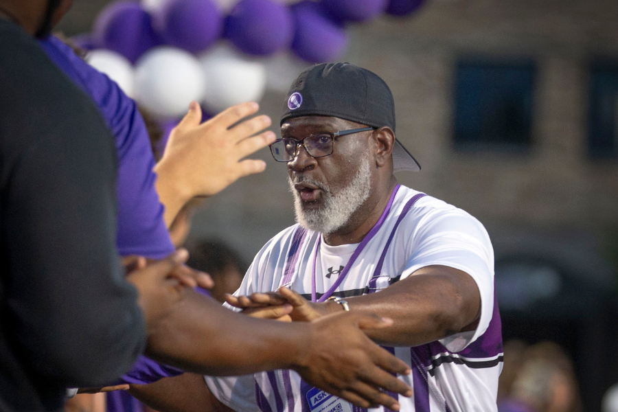 Chancellor Corey A. King greets students as he moves through a tunnel of welcoming Warhawks during the annual RU Purple Rally on Monday, Sept. 1, 2025.