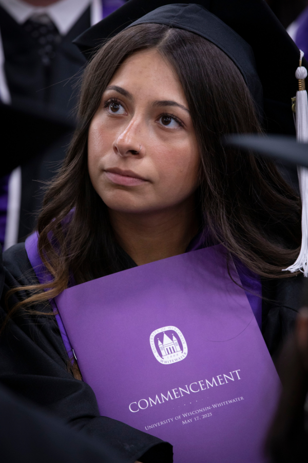 Student looks at the stage during commencement.