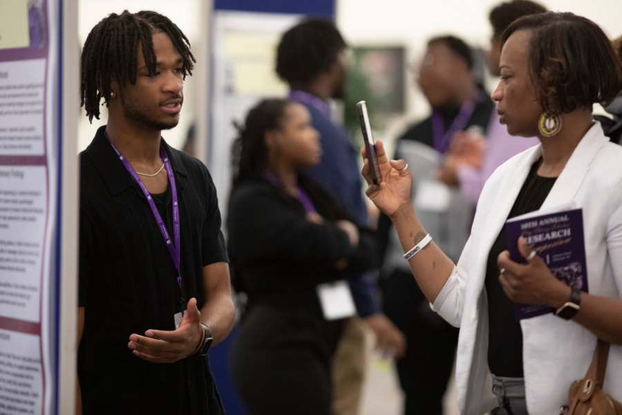 A student presents their undergraduate research project.