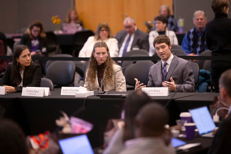 A student speaks while others listen.