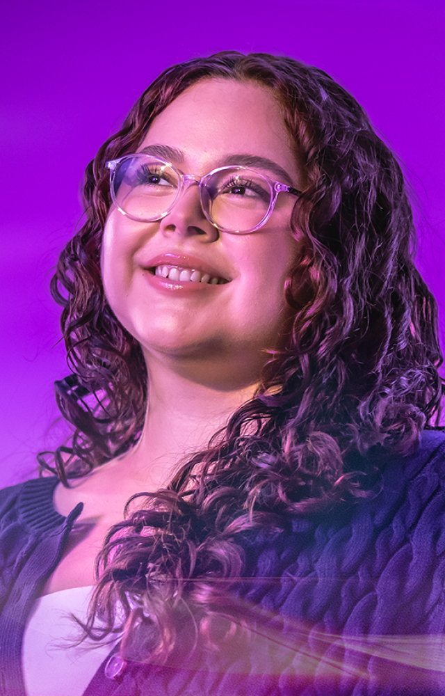 Student poses for College of Business photo shoot