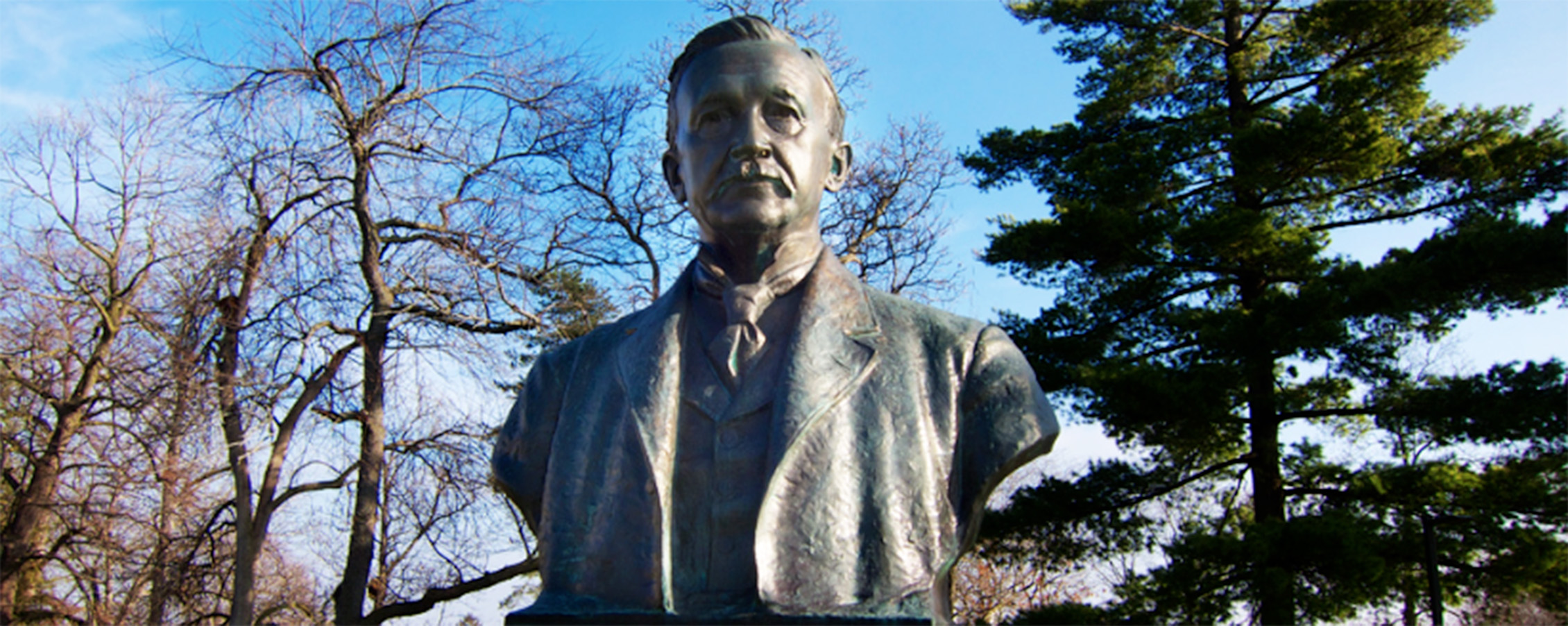 sculpture of Albert Salisbury with trees in the background