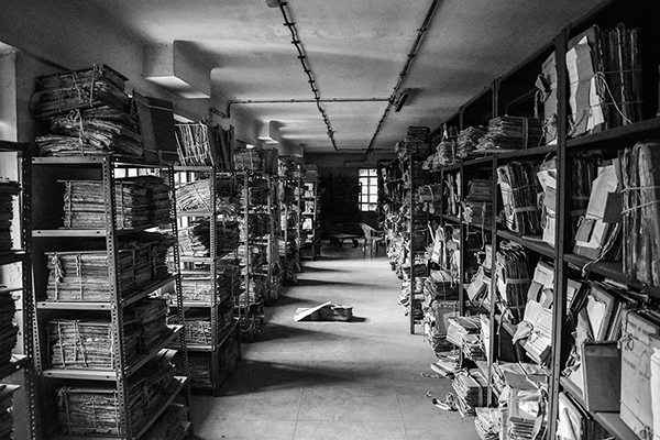 shelves of manuscripts in black and white