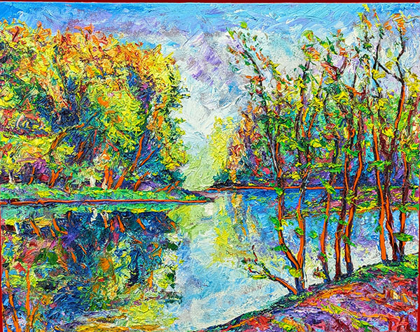 Painting of a river with trees on the shore with green, red, and yellow leaves and a blue sky behind them